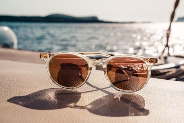 Photo by Sebastian Coman Travel white framed brown lens sunglasses